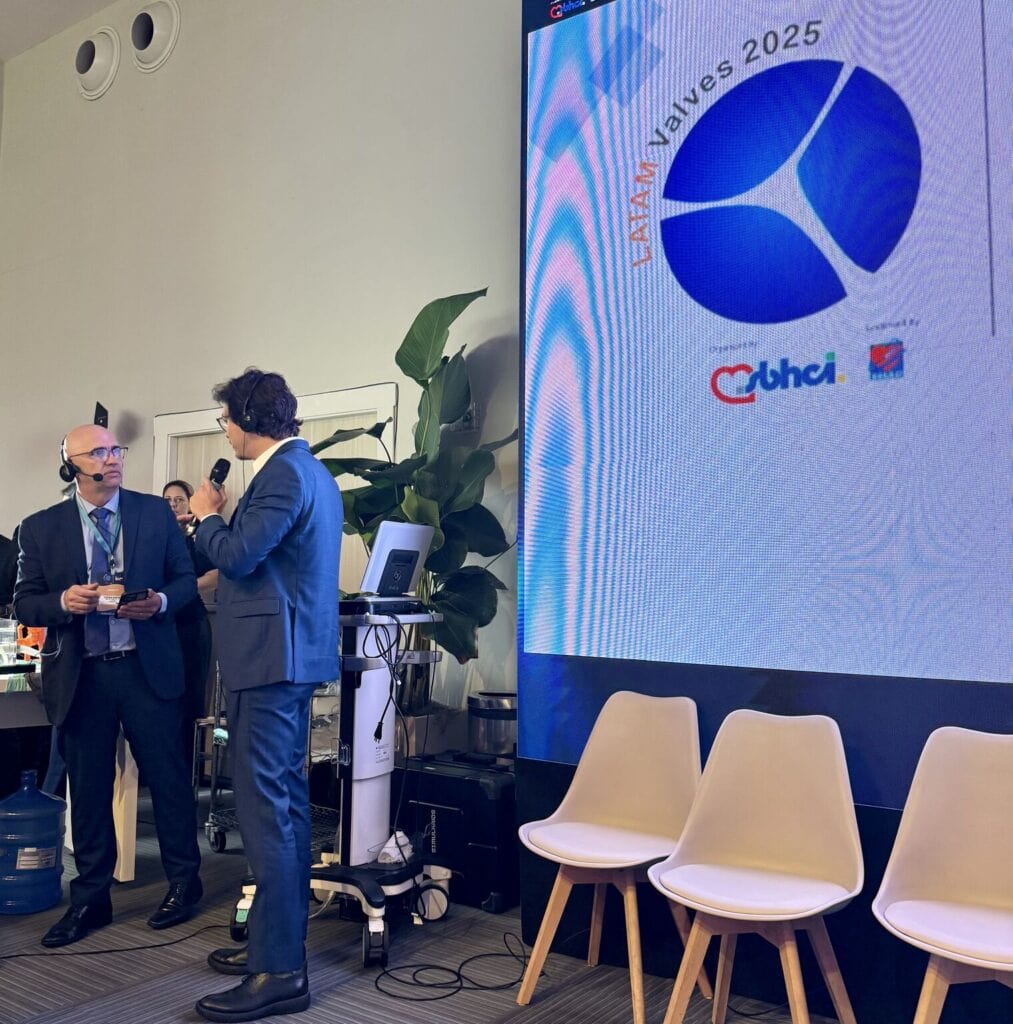 two men at a podium speaking at the LATAM Valves event