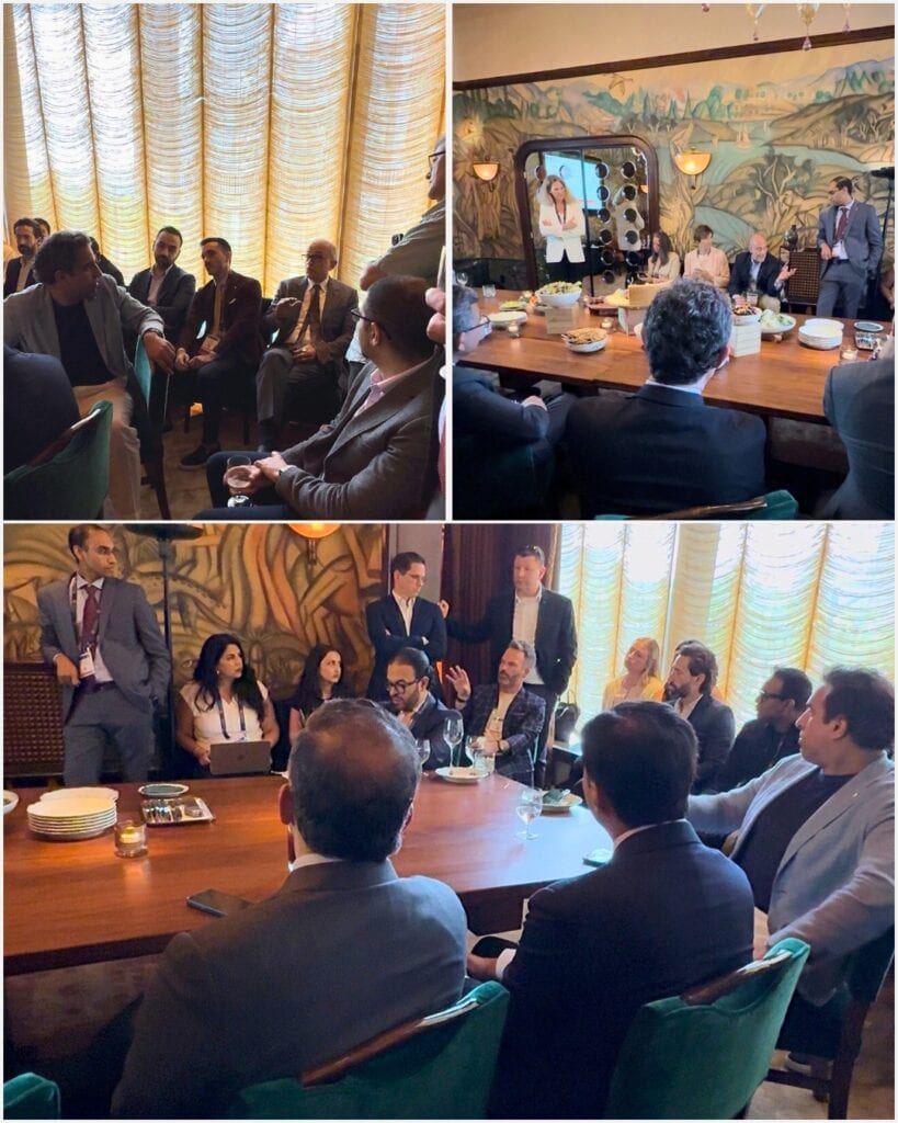 Business professionals at the New York Valves 2025 networking event having a discussion at a table