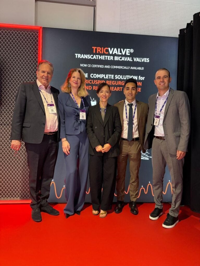 P&F team posing at the branded booth at EuroPCR 2025