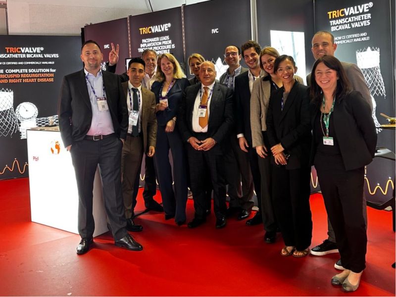 P&F team posing at the branded booth at EuroPCR 2025