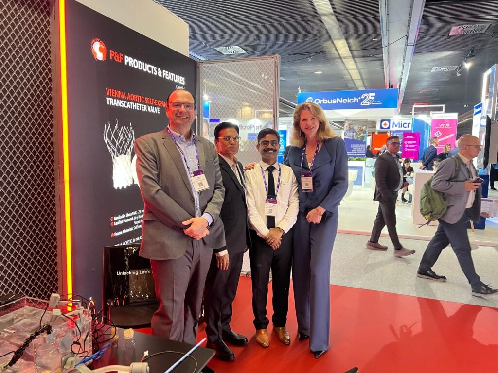 P&F team posing at the branded booth at EuroPCR 2025
