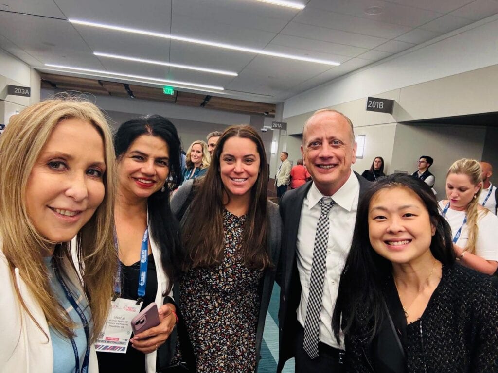 Five people posing for a selfie at HFSA Annual Scientific Meeting 2025