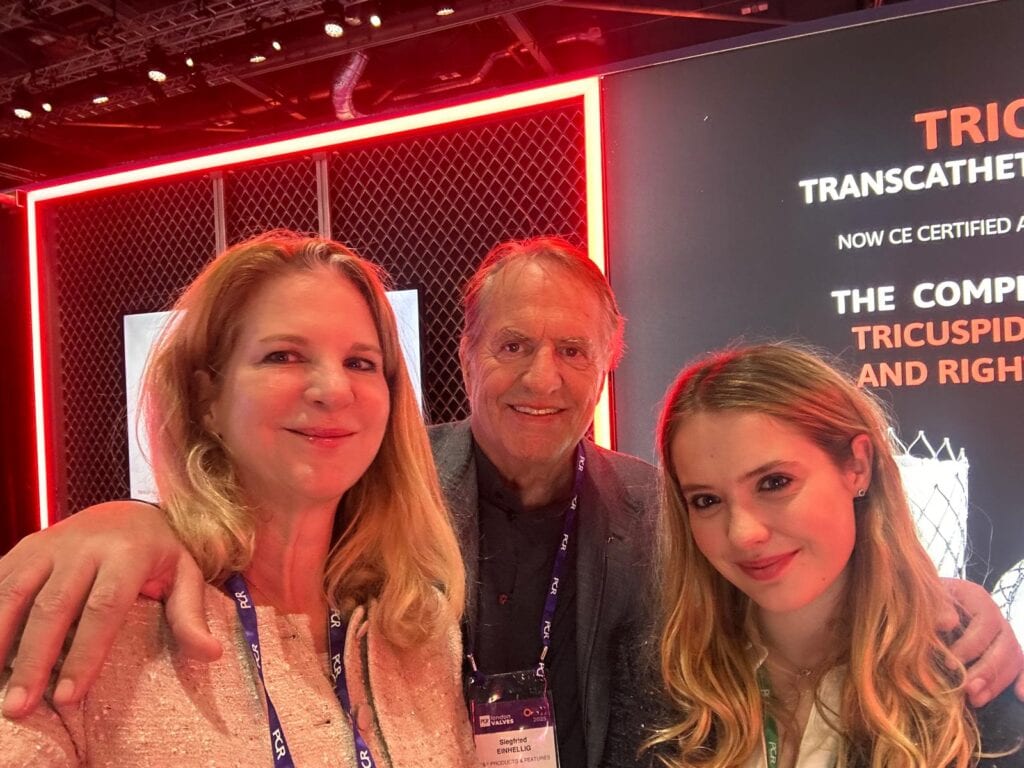 Three people taking a selfie at the P&F booth